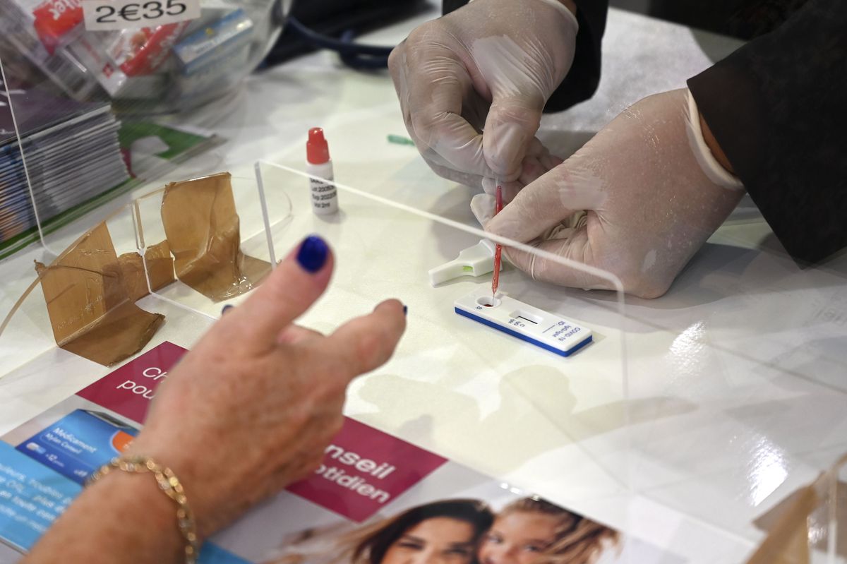 A pharmacist administers a Covid-19 antibody test in Strasbourg, France.